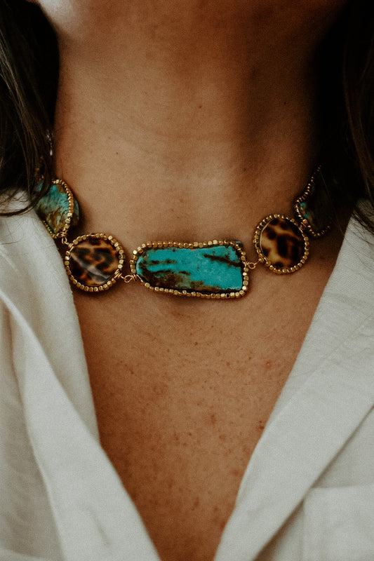 Gold plated stainless steel choker with 5 wire wrapped genuine turquoise slabs, 4 wire wrapped tiger cowrie shell. 14"-17" long